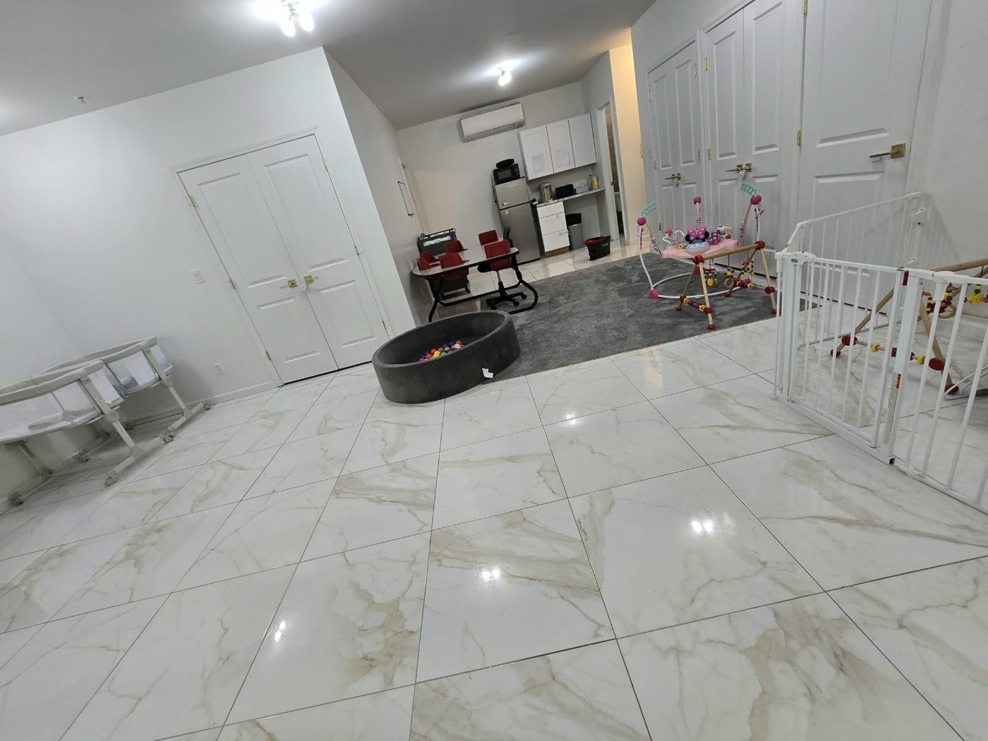 Shining marble-look tile floor in a bright common area